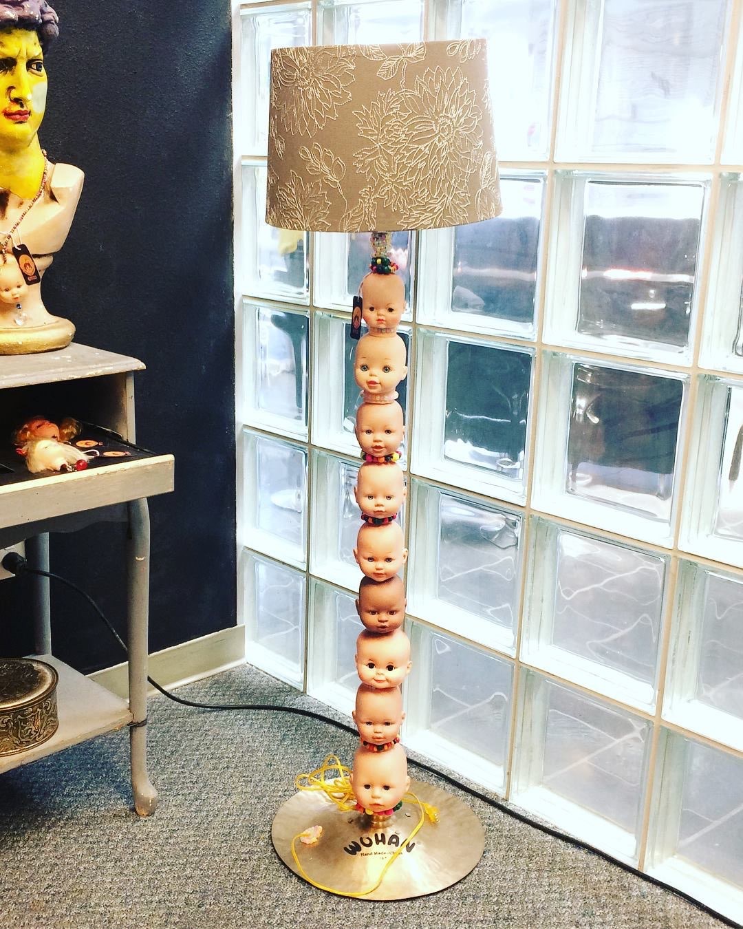 doll head as base of lamp art