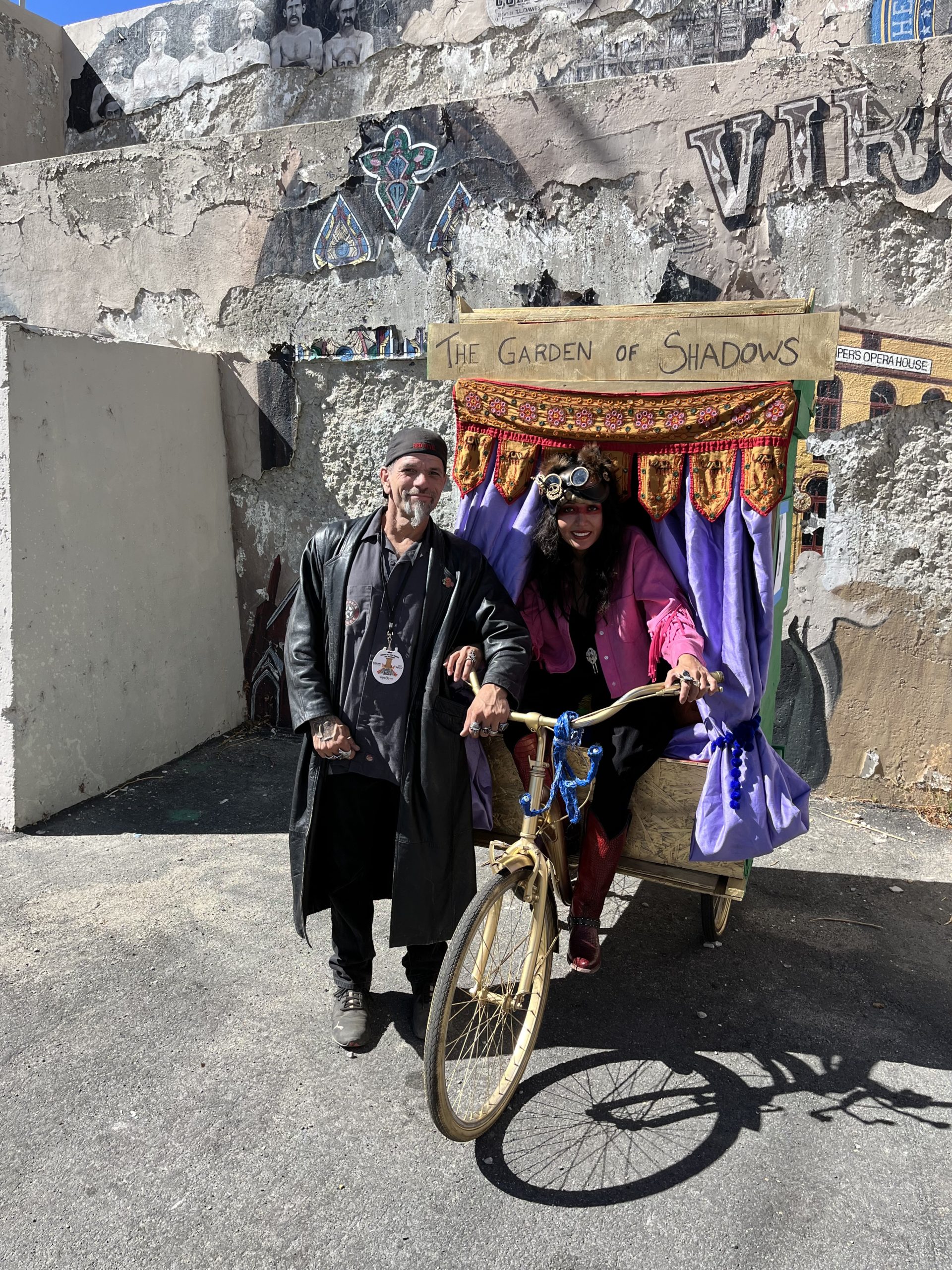 man and woman on a bike outhouse